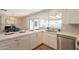 Modern kitchen showcasing white cabinetry, stainless steel appliances, and an open design at 3118 S Los Altos Dr, Mesa, AZ 85202