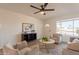 Comfortable living room with a large window, neutral decor, and stylish furnishings creating a cozy atmosphere at 3118 S Los Altos Dr, Mesa, AZ 85202