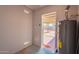 Utility room with efficient hot water heater and access to the large backyard at 3118 S Los Altos Dr, Mesa, AZ 85202