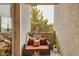 Private balcony featuring seating for outdoor relaxation and a view of greenery at 3330 S Gilbert Rd # 2090, Chandler, AZ 85286