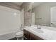 Bathroom with a vanity, mirror, toilet, and tub with shower at 3422 E Strawberry Dr, Gilbert, AZ 85298