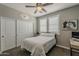 Bedroom with a ceiling fan, closet, and natural light at 3422 E Strawberry Dr, Gilbert, AZ 85298