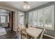 Bright dining room with backyard views from large windows at 3422 E Strawberry Dr, Gilbert, AZ 85298