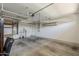 Garage featuring an insulated door, storage shelves and a drop-down rack at 3422 E Strawberry Dr, Gilbert, AZ 85298