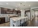 Spacious kitchen with a large island, stainless steel appliances, and dark wood cabinetry, perfect for cooking and entertaining at 3422 E Strawberry Dr, Gilbert, AZ 85298