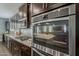 This gourmet kitchen features stainless steel appliances and beautiful granite countertops at 3422 E Strawberry Dr, Gilbert, AZ 85298