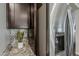 This kitchen features a stainless steel refrigerator and granite countertops at 3422 E Strawberry Dr, Gilbert, AZ 85298