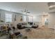 Spacious upstairs living room features a ceiling fan, ample seating, and a view towards the staircase at 3422 E Strawberry Dr, Gilbert, AZ 85298