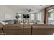 Spacious living room featuring a ceiling fan, and stylish decor creating a welcoming atmosphere at 3422 E Strawberry Dr, Gilbert, AZ 85298