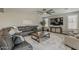 Cozy living room features stylish decor and a large sectional sofa at 3422 E Strawberry Dr, Gilbert, AZ 85298