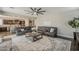 Open living room boasts a comfortable seating arrangement and connects to the kitchen and dining area at 3422 E Strawberry Dr, Gilbert, AZ 85298