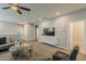 Second-floor living room, complete with plush seating, a ceiling fan, and an entertainment area at 3422 E Strawberry Dr, Gilbert, AZ 85298