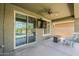Covered patio with fan, TV, and seating at 3422 E Strawberry Dr, Gilbert, AZ 85298