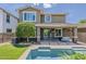 Picturesque backyard showcasing a sparkling pool, covered patio, and ample space for leisure and recreation at 3422 E Strawberry Dr, Gilbert, AZ 85298