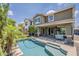 Beautiful pool and backyard with a covered patio and lush landscaping, perfect for enjoying sunny days at 3422 E Strawberry Dr, Gilbert, AZ 85298