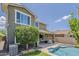 Lush backyard with a refreshing pool and covered patio, ideal for outdoor relaxation and entertaining at 3422 E Strawberry Dr, Gilbert, AZ 85298