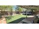 Private backyard features a trampoline and artificial turf, perfect for outdoor activities and low maintenance at 3446 N Ravine --, Mesa, AZ 85215