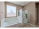 Relaxing bathroom features a soaking tub and a separate glass-enclosed shower at 3458 E Ivanhoe St, Gilbert, AZ 85295
