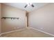 The bedroom offers neutral colors, a ceiling fan, closet, and a clean design at 3458 E Ivanhoe St, Gilbert, AZ 85295