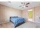 Bedroom boasts carpet floors, ceiling fan, and bathroom access, offering a serene and private space at 3458 E Ivanhoe St, Gilbert, AZ 85295