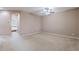 Bedroom with carpet flooring, ceiling fan, and an en-suite bathroom at 3458 E Ivanhoe St, Gilbert, AZ 85295