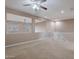 Open bonus room features neutral walls, carpeted floors, ceiling fan, and views to the windows below at 3458 E Ivanhoe St, Gilbert, AZ 85295