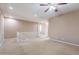 Bright bonus room with carpet flooring, a ceiling fan, and a railing overlooking the lower level at 3458 E Ivanhoe St, Gilbert, AZ 85295