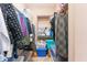 Walk-in closet with a variety of clothing, shelving, and storage containers at 3458 E Ivanhoe St, Gilbert, AZ 85295