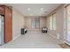 Well-lit dining room with tile flooring, modern blinds, and an exterior door at 3458 E Ivanhoe St, Gilbert, AZ 85295