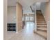 Inviting entryway features neutral tones, tile flooring, and an open staircase leading to the upper level at 3458 E Ivanhoe St, Gilbert, AZ 85295