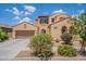 Charming two-story home with a two-car garage, stucco exterior, and well-manicured landscaping at 3458 E Ivanhoe St, Gilbert, AZ 85295