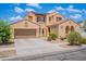 Charming two-story home with a well-maintained front yard, tile roof, and a two-car garage at 3458 E Ivanhoe St, Gilbert, AZ 85295