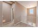 Hallway with neutral-toned walls, carpet flooring, and natural light from the window at 3458 E Ivanhoe St, Gilbert, AZ 85295