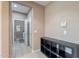 Hallway that leads to laundry room with a white washer and dryer at 3458 E Ivanhoe St, Gilbert, AZ 85295