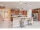 Spacious kitchen features stainless steel appliances, granite countertops, and a breakfast bar with seating at 3458 E Ivanhoe St, Gilbert, AZ 85295