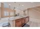 Bright kitchen with granite island, modern appliances, and high ceilings leading into a spacious living area, perfect for entertaining at 3458 E Ivanhoe St, Gilbert, AZ 85295