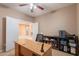Functional home office with a spacious desk, neutral walls, carpet, and ample storage, ideal for a productive work environment at 3458 E Ivanhoe St, Gilbert, AZ 85295
