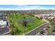 Scenic aerial view of the community featuring a golf course and pond, nestled in a green landscape at 3500 N Hayden Rd # 2110, Scottsdale, AZ 85251