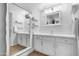Bright bathroom features double mirror, dual sink, vanity, and modern fixtures at 3500 N Hayden Rd # 2110, Scottsdale, AZ 85251