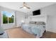 Bedroom with a full size bed, wood floors, and large window at 3500 N Hayden Rd # 2110, Scottsdale, AZ 85251