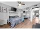 Bedroom featuring a full size bed and mirrored closet doors with wood flooring at 3500 N Hayden Rd # 2110, Scottsdale, AZ 85251