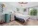 Inviting bedroom with a ceiling fan, neutral walls, and stylish furnishings at 3500 N Hayden Rd # 2110, Scottsdale, AZ 85251