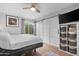 Charming bedroom with a ceiling fan, sliding barn door, and natural light at 3500 N Hayden Rd # 2110, Scottsdale, AZ 85251