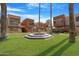 Beautiful courtyard with a decorative fountain surrounded by well-maintained landscaping and modern architecture at 3500 N Hayden Rd # 2110, Scottsdale, AZ 85251
