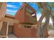 Modern, multi-story home featuring a private balcony with unique lattice work and a tree in the foreground at 3500 N Hayden Rd # 2110, Scottsdale, AZ 85251