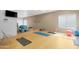 Brightly lit yoga room featuring mats, exercise balls, and ample space for fitness activities at 3500 N Hayden Rd # 2110, Scottsdale, AZ 85251