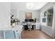 Bright home office features a large window, dual monitors, and stylish decor at 3500 N Hayden Rd # 2110, Scottsdale, AZ 85251