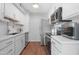 Updated kitchen showcasing stainless steel appliances, sleek white cabinets, and modern finishes at 3500 N Hayden Rd # 2110, Scottsdale, AZ 85251