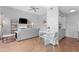 Open concept living area with hardwood floors, neutral paint and comfortable seating adjacent to dining at 3500 N Hayden Rd # 2110, Scottsdale, AZ 85251