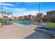 Resort-style pool with lounge chairs surrounded by lush landscaping at 3500 N Hayden Rd # 2110, Scottsdale, AZ 85251